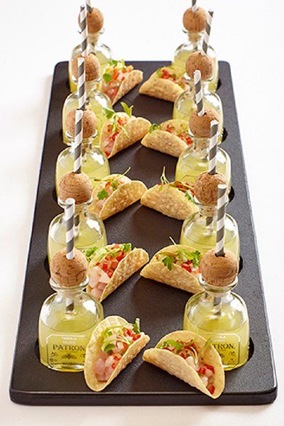 Such a cute pairing! Mini Patron tequilas with taco bites.