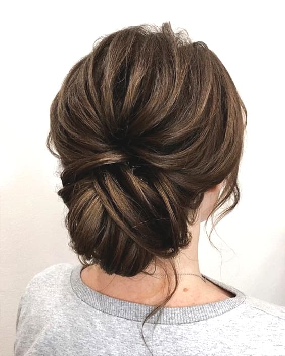 messy-brunette-low-updo-wedding-hairstyle-min