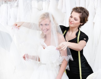 Bride trying on her dress for a final dress fitting