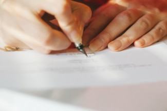 Bride writing her vows