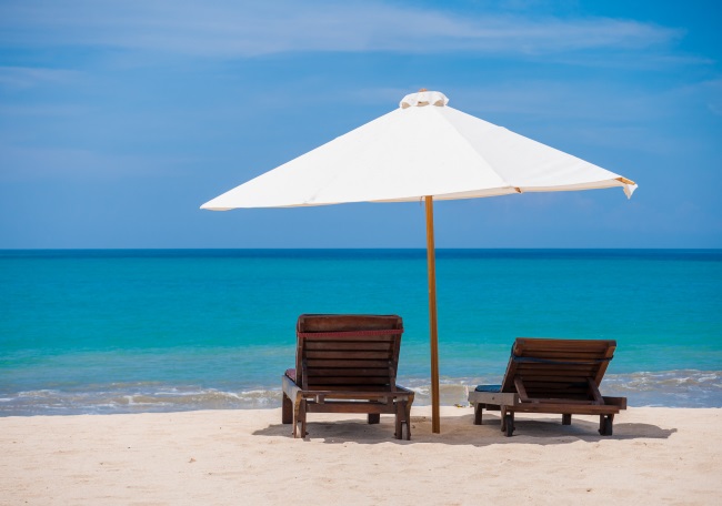 Two beach chairs for a couple on theri honeymoon